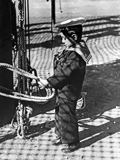 Anchored: Marinaretti boy winding ropes, 1933