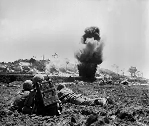 Offensives: Marine demolition crew watch dynamite charges
