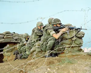 Peacekeepers: Marines take cover behind sandbags during ?