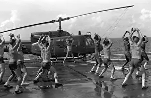 Chested: Marines doing jumping jacks on the deck ?