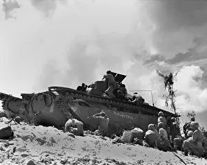 Breather: Marines fight from the shelter of an amphibious