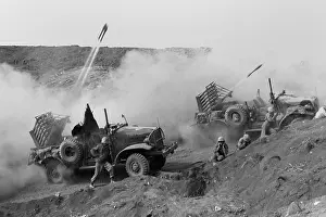 Offensives: Marines launch rockets toward Japanese positions
