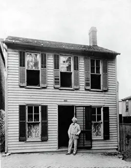 Boyhood: MARK TWAIN in front of his boyhood home ?
