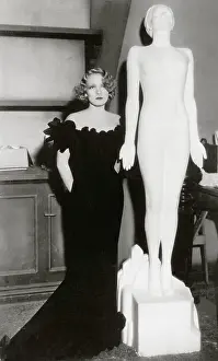 Marlene Dietrich with a statue