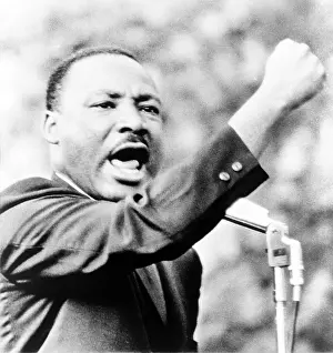 Girard: Martin Luther King, Jr. gesturing with ?