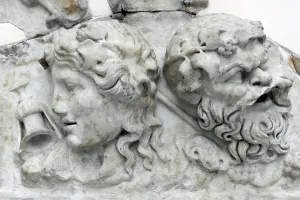 Bearded: Masks of Dionysos and Silenos. Roman relief. 2nd century AD