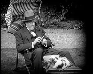 Matheson: Matheson Lang Relaxing in a Deck Chair Smoking