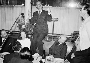Sings: Maurice Chevalier in a restaurant, 1941