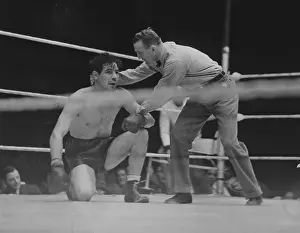 Kneels: Max Baer on the ground, 1935