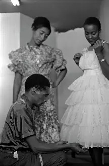 Succes: May 1963 - Model Mojaki looks on as Molefe fiddles