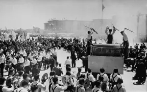 Tiananmen: May Day in Beijing. People parade past a ?