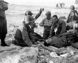 Transfusion: Medics administer a plasma transfusion to a wounded