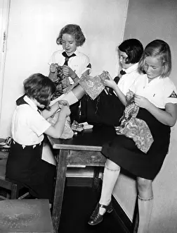 Aprons: Members of the BDM doing handicrafts in Berlin-Charlotte