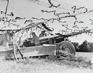 Towed: Members of a field artillery battery with