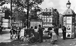 Pigalle: Members of the public stop to look at a map