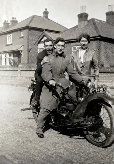 Threesome: Two men on 1925 Neracar motorcycle