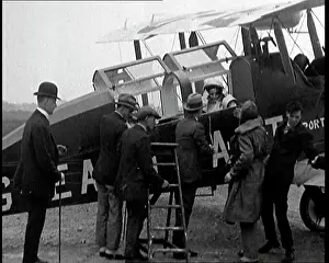Propping: Men Approaching A Passenger Biplane As It Comes