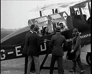 Propping: Men Approaching A Passenger Biplane As It Comes