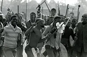 Assegais: Men, armed with traditional weapons, and some