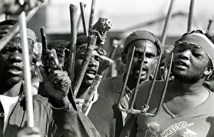 Assegais: Men, armed with traditional weapons, and some
