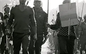 Assegais: Men, armed with traditional weapons, run in rough