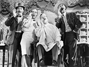 Cooperate: Four men at a barber shop singing
