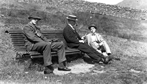 Thre: Three men on a bench