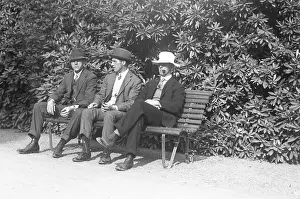 Three men on a bench