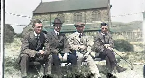 Whit: Four men on a bench at golf club