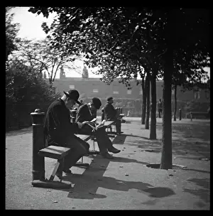 Terraced: Men on benches in a London park