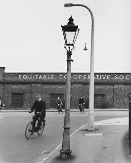 Operative: Three men on bicycles