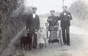 Wheelchair: Three men and a boy with a dog