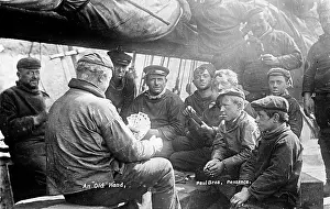 Penzance: Men and boys playing cards, Penzance, Cornwall
