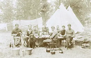 Men camping with a dog