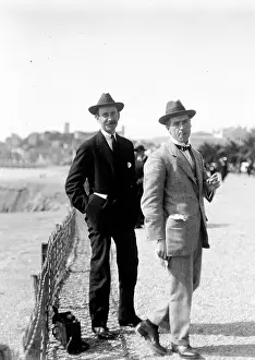 Poss: Two men on Cannes seafront