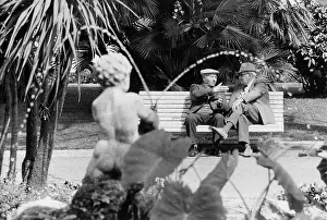 Spout: Two men chatting on a park bench