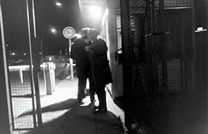 Capitalist: Men at a checkpoint, Berlin, Germany