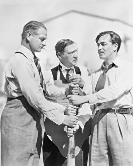 Decisions: Three men competing who will start first on a baseball bat