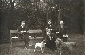 Shaggy: Four men and two dogs in a garden