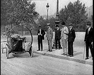 Men Driving A Propeller Driven Car