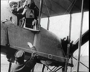 Embarked: Two Men Are Embarked On An Early Military Biplane
