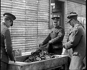 Emptying: Men Emptying Salvaged Items Into A Large Container