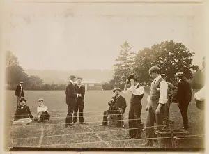 Boaters: Men engaged in sporting activity in a field