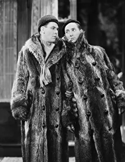 Consult: Two men in fur coats