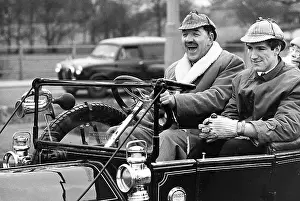 Headlamp: Two men having fun in a vintage car