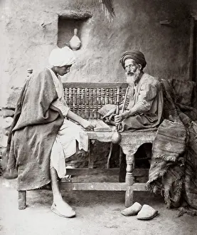 Hookah: Men with hookah pipe playing board game, Egypt, c.1880's