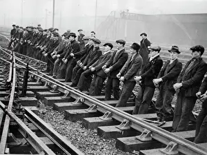 Willesden: Men levers new railway lines into