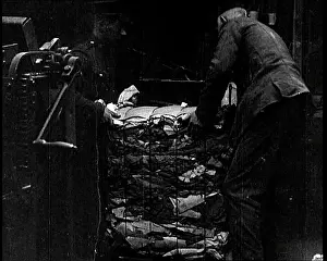 Bales: Men Loading Bales Of Salvaged Cloth Onto A Cart