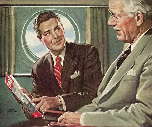 Airliners: Two Men look at Magazine in Airplane