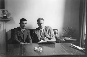 Settee: Two men looking rather serious